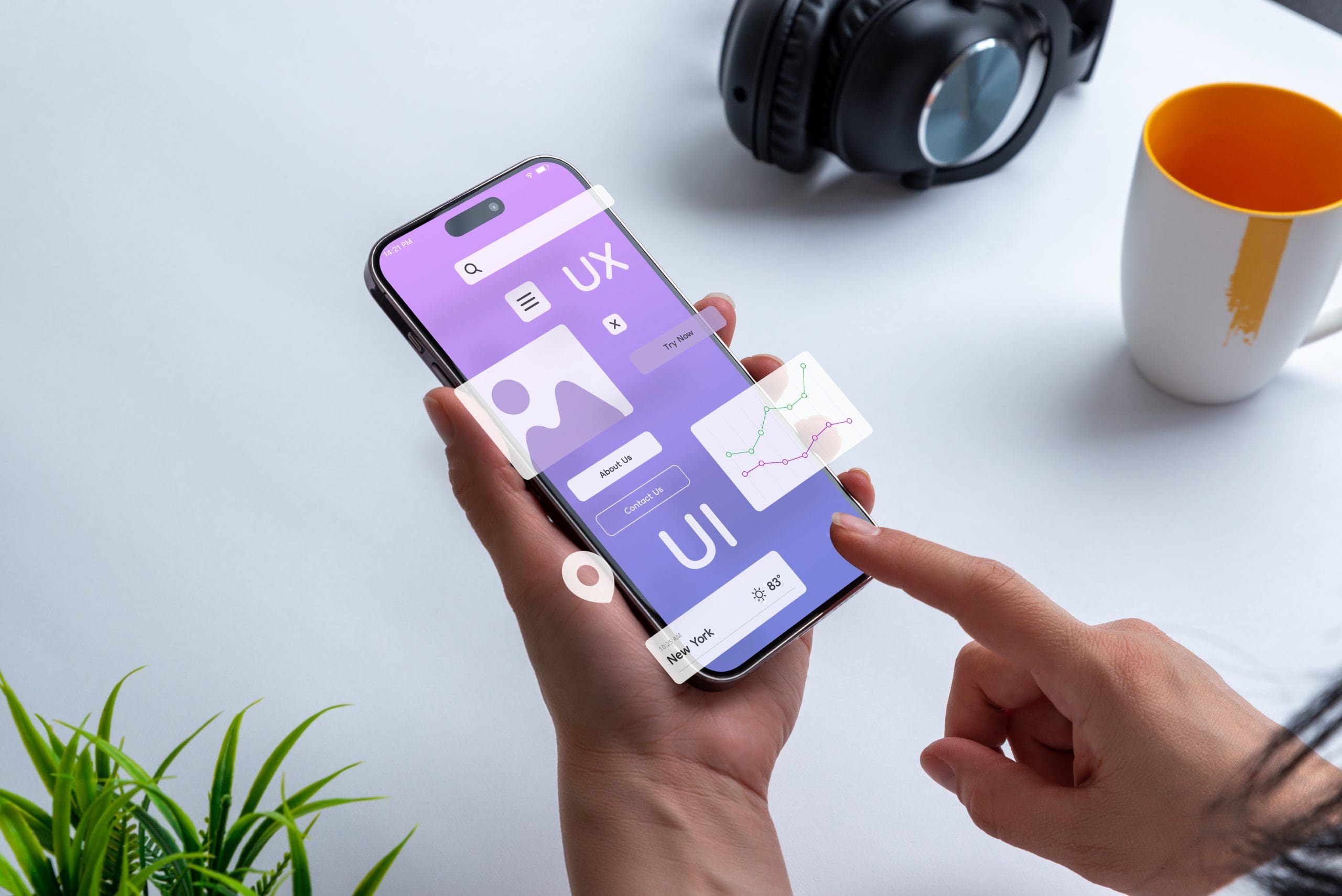 A woman is holding a phone with a ui design on it.